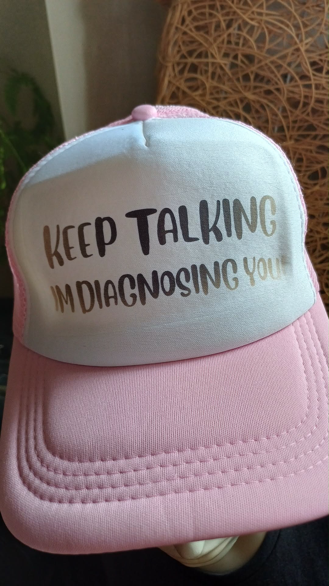 Trucker cap with "Keep Talking, I'm Diagnosing You" print