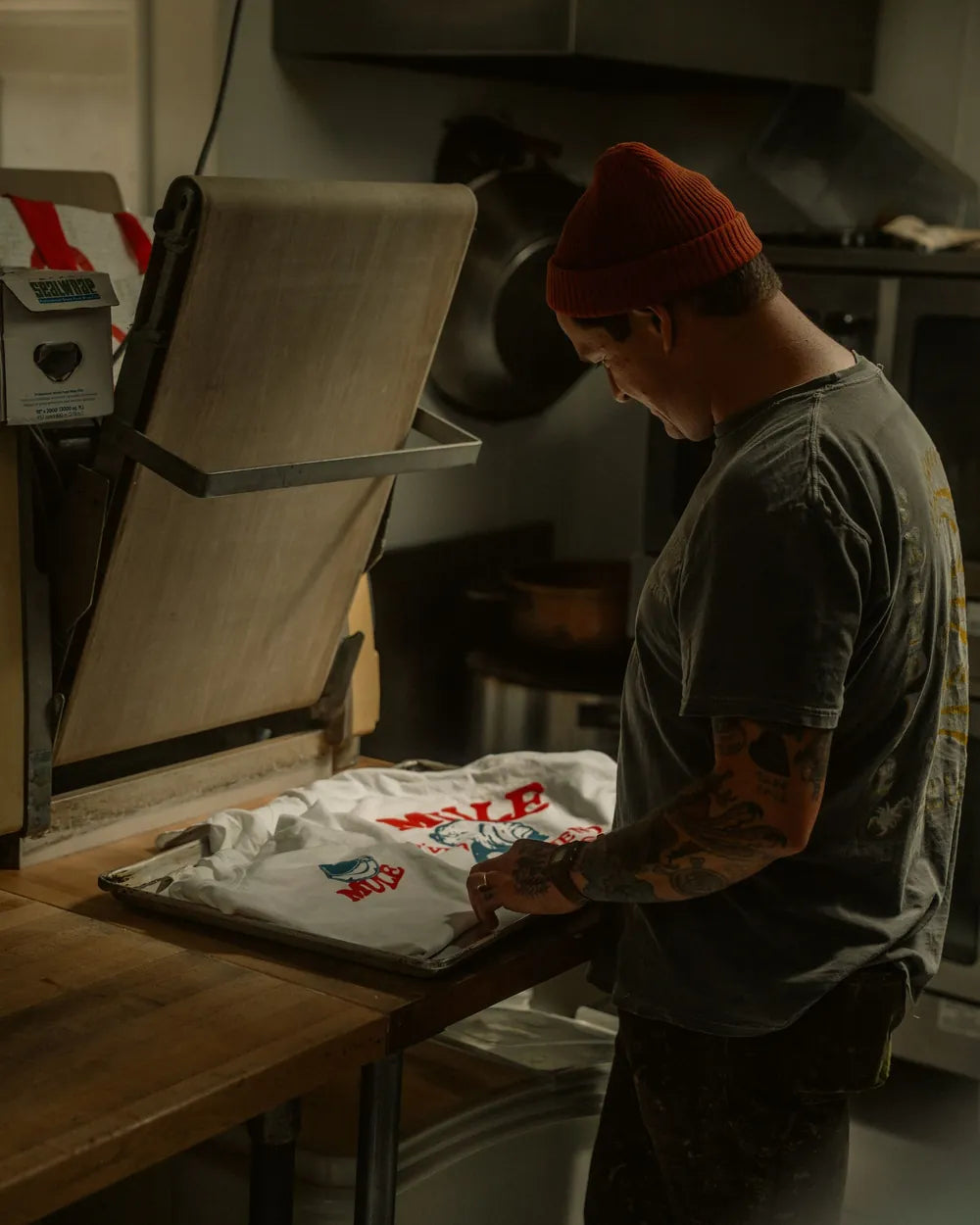 A custom T-shirt being pressed on a heat press